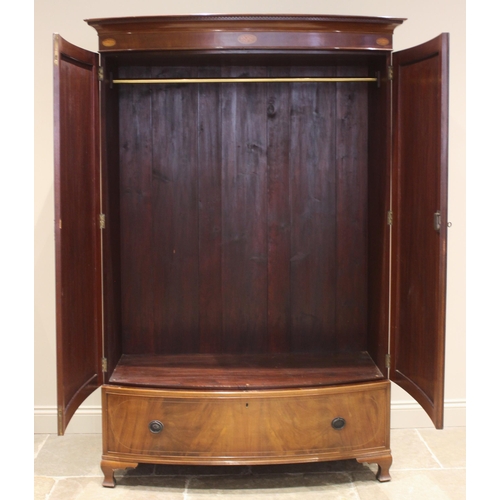 490 - An Edwardian mahogany bowfront double wardrobe, the moulded Greek pattern cornice over a frieze inla... 