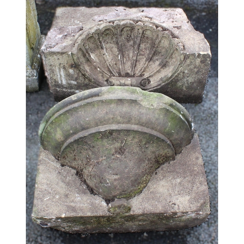 526 - A sandstone alcove or water feature pediment, carved as an inverted shell, 36cm H x 75cm W x 32cm D,... 