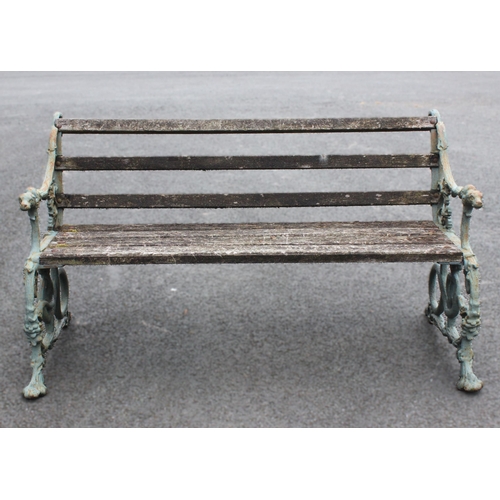 528 - A Victorian Coalbrookdale style cast iron serpent and grape pattern garden bench, the painted cast s... 