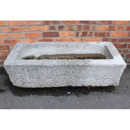 532 - An 18th/19th century granite trough, of rectangular form, with drain hole to the interior, scored ve... 