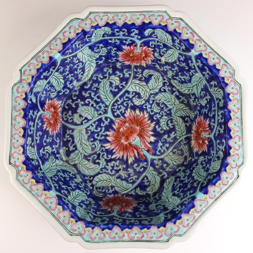 323 - A Chinese Peranaken Market porcelain water basin, of octagonal form, bearing iron-red seal mark to t... 