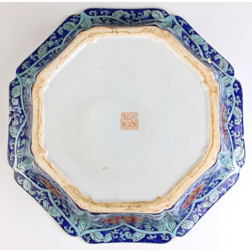 323 - A Chinese Peranaken Market porcelain water basin, of octagonal form, bearing iron-red seal mark to t... 