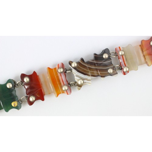 62A - A Victorian style banded agate bracelet, the five shaped banded agate panels with engraved white met... 