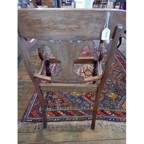 462 - A pair of William IV mahogany library/carver chairs, each with a concave top rail and scrolled termi... 