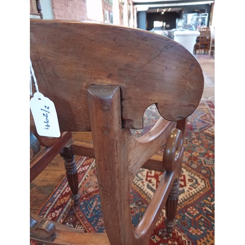 462 - A pair of William IV mahogany library/carver chairs, each with a concave top rail and scrolled termi... 