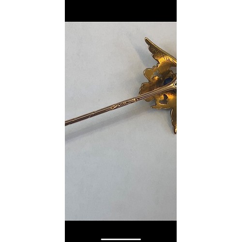 113 - An early 20th century Russian untested sapphire set stick pin, possibly by Faberge, the central oval... 