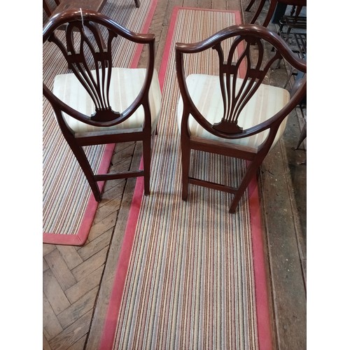 439 - A set of five Hepplewhite style mahogany dining chairs, 19th century, each with a shield shaped back... 