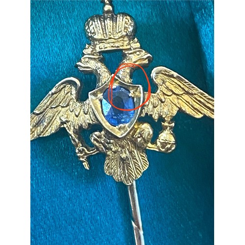 113 - An early 20th century Russian untested sapphire set stick pin, possibly by Faberge, the central oval... 