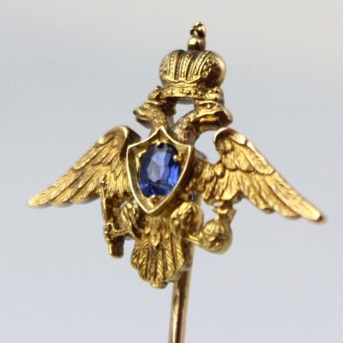 113 - An early 20th century Russian untested sapphire set stick pin, possibly by Faberge, the central oval... 