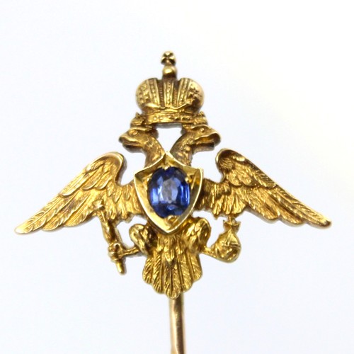 113 - An early 20th century Russian untested sapphire set stick pin, possibly by Faberge, the central oval... 