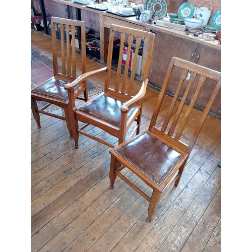 500 - A set of six golden oak Arts and Crafts style dining chairs, early 20th century, each with an angula... 