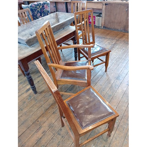 500 - A set of six golden oak Arts and Crafts style dining chairs, early 20th century, each with an angula... 