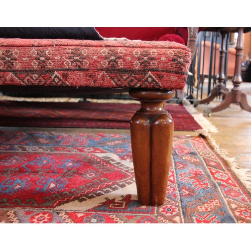 514A - A kilim foot stool, of country house proportions, the square top covered in red and black geometric ... 