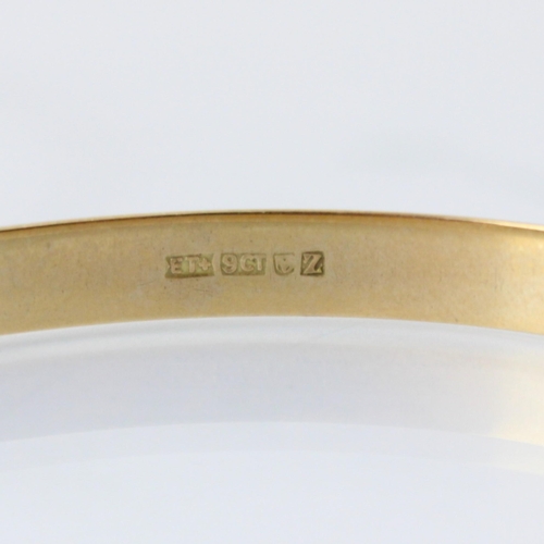 103 - A set of four South African yellow metal bangles, of plain polished form, stamped to interior ‘9ct’ ... 