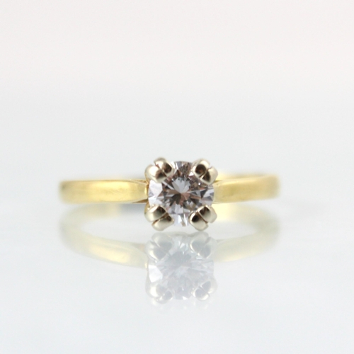 106 - An Edwardian style diamond solitaire ring, the round cut diamond within four double claw setting edg... 