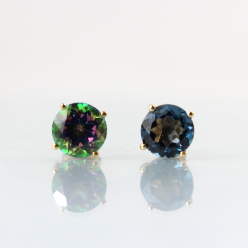 111 - A pair of mystic topaz stud earrings, the round cut stones within claw setting edge, with post and b... 