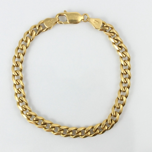 114 - An Italian yellow metal curb link bracelet, the links with lobster fastener stamped ‘750 Italy’ 20.5... 