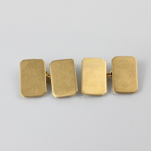 115 - A pair of 9ct yellow gold cufflinks, the plain polished rectangular links with canted corners, stamp... 