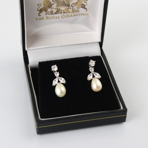 119 - A pair of ‘The Royal Collection’ paste set earrings, the round cut stones suspending further pear cu... 