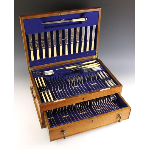 12 - A 20th century oak cased Goldsmiths & Silversmith silver plated canteen of cutlery, the six place Ol... 