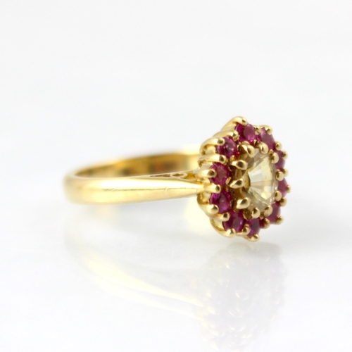 121 - A bespoke untested yellow sapphire and pink spinel cluster ring, the central oval cut untested yello... 