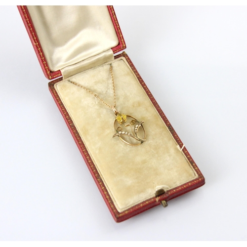 124 - An early 20th century untested citrine and seed pearl pendant, the trefoil cut untested citrine with... 