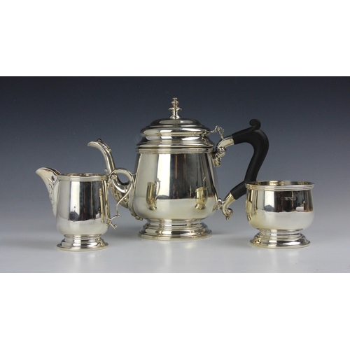 13 - A three piece silver tea service, Charles S Green & Co Ltd, Birmingham 1977/76, comprising tea pot, ... 