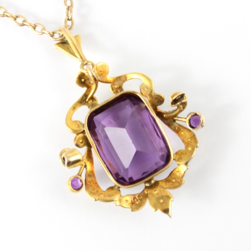 131 - An early 20th century amethyst and pearl pendant, the central cushion cut style amethyst set within ... 