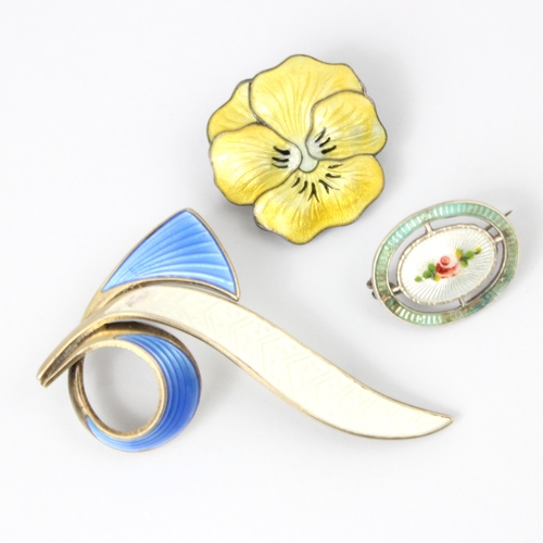 133 - A group of three enamel brooches, including a John Atkins and Sons Arts and Crafts enamel pansy broo... 