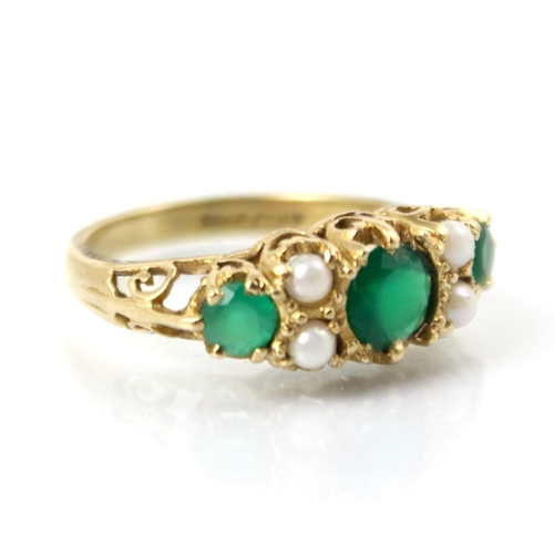 134 - A 9ct yellow gold Victorian style untested emerald and pearl ring, the central round cut green stone... 