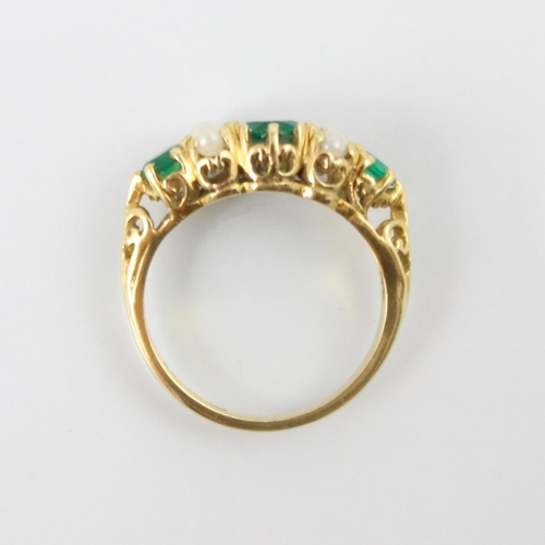 134 - A 9ct yellow gold Victorian style untested emerald and pearl ring, the central round cut green stone... 