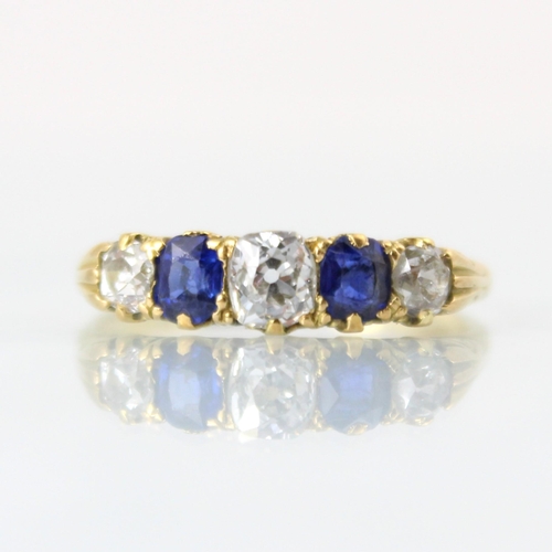 145 - A Victorian diamond and untested sapphire ring, the central old cut diamond with cushion cut unteste... 