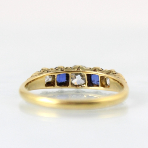 145 - A Victorian diamond and untested sapphire ring, the central old cut diamond with cushion cut unteste... 