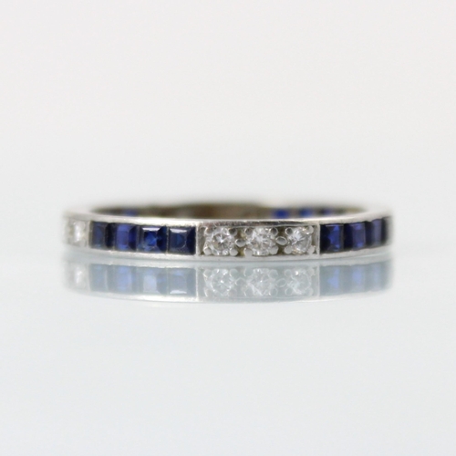 150 - An Art Deco diamond and untested sapphire full eternity ring, the three round cut diamonds with four... 