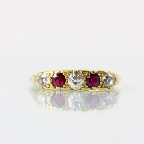 151 - A Victorian style diamond and untested ruby five stone diamond ring, the central old cut diamond wit... 