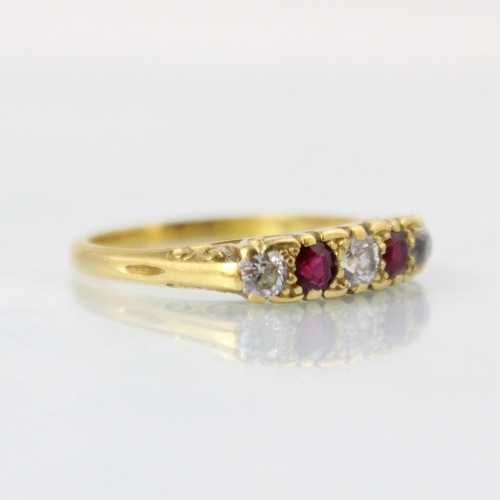 151 - A Victorian style diamond and untested ruby five stone diamond ring, the central old cut diamond wit... 