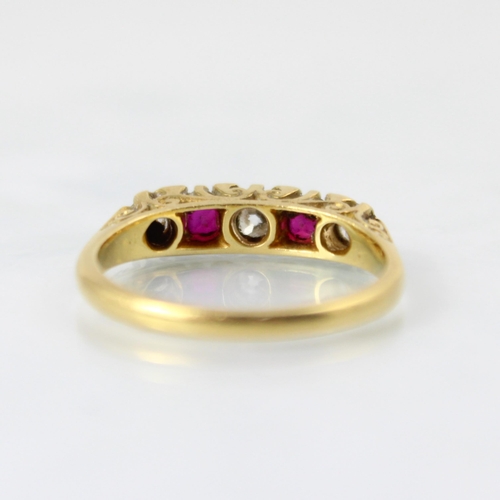 151 - A Victorian style diamond and untested ruby five stone diamond ring, the central old cut diamond wit... 