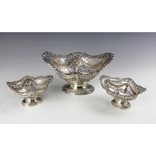 26 - An Edwardian garniture of three silver dishes, George Nathan & Ridley Hayes, Chester 1904, the openw... 