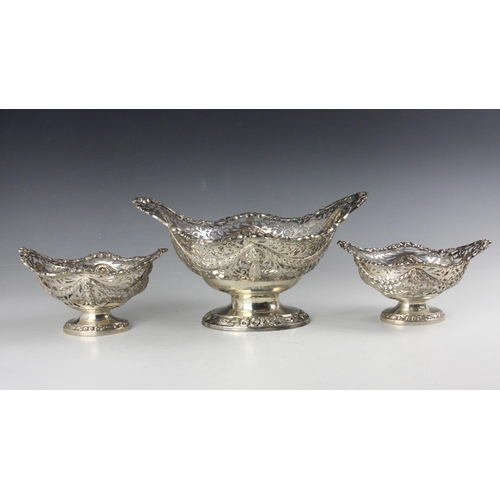 26 - An Edwardian garniture of three silver dishes, George Nathan & Ridley Hayes, Chester 1904, the openw... 