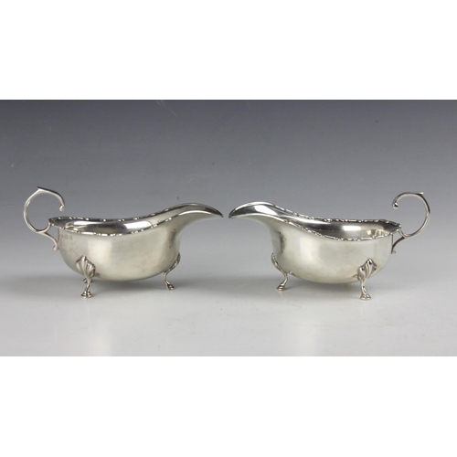 30 - A pair of George V silver sauce boats, Adie Brothers Ltd, Birmingham 1933, the flying scroll handle ... 