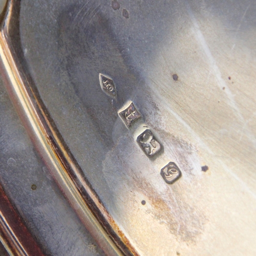 4 - A silver salver, JT Deeley Ltd, Birmingham 1981, the shaped rim above plain body, upon three acanthu... 