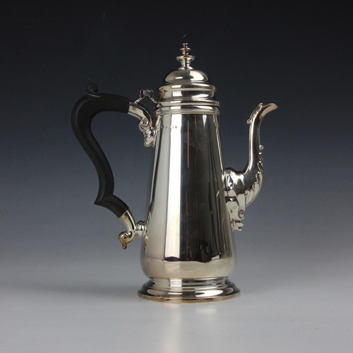 5 - A Georgian style silver coffee pot, possibly Albert Edward Jones, Birmingham 2000, the shaped finial... 