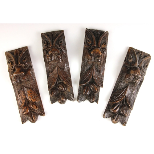 533 - A set of four carved oak lion mask corbels, 19th century, each relief carved with a lions mask over ... 