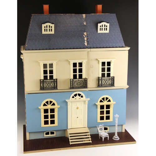 575 - A dolls house, late 20th century, modelled as a three storey French style country house, the frontag... 