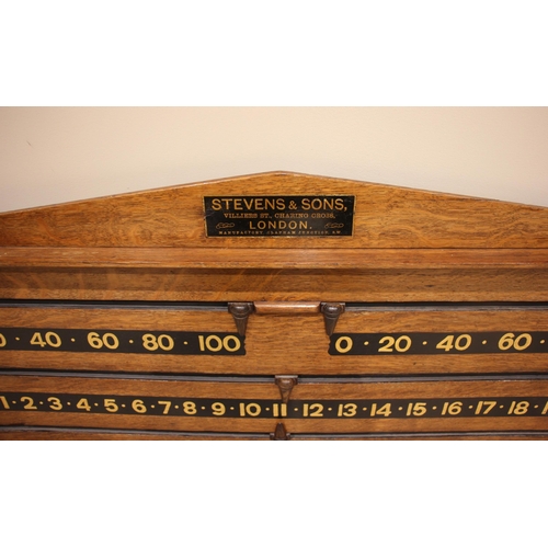 577 - A Stevens & Sons of London billiard/snooker scoreboard, early 20th century, in medium oak with four ... 