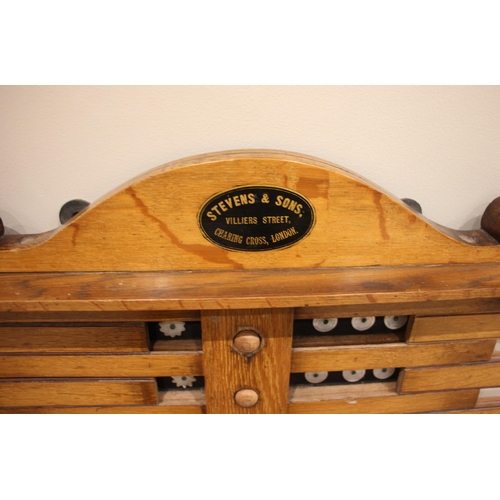 577 - A Stevens & Sons of London billiard/snooker scoreboard, early 20th century, in medium oak with four ... 