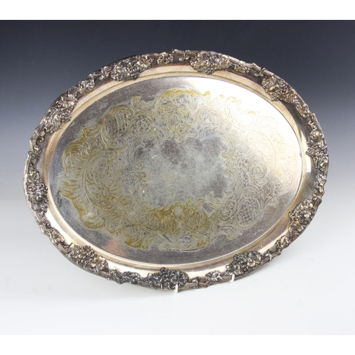 58 - An Elkington & Co. silver plated oval tray, with cast grape designed border above engraved body, 50c... 