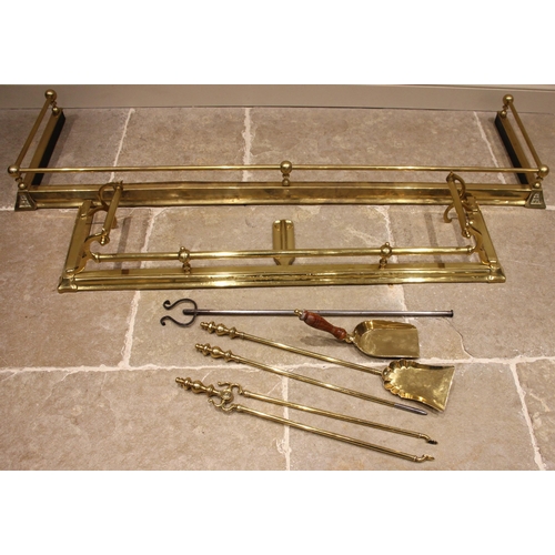 594 - A brass rail mounted fire kerb, of country house proportions, early 20th century, 177cm wide, a seco... 