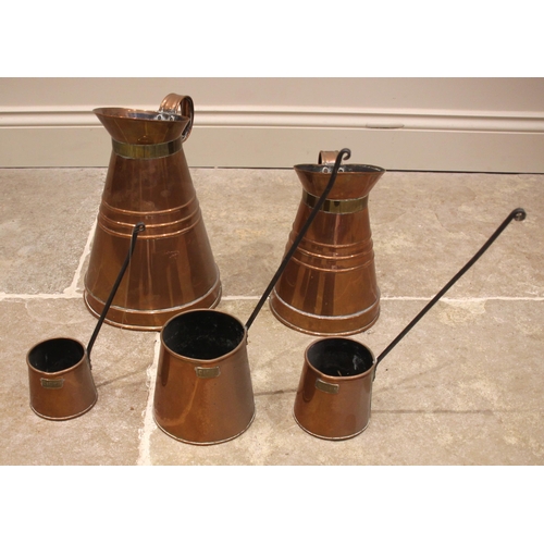 597 - A set of three 19th century copper cider measures, along with two graduated copper haystack form jug... 