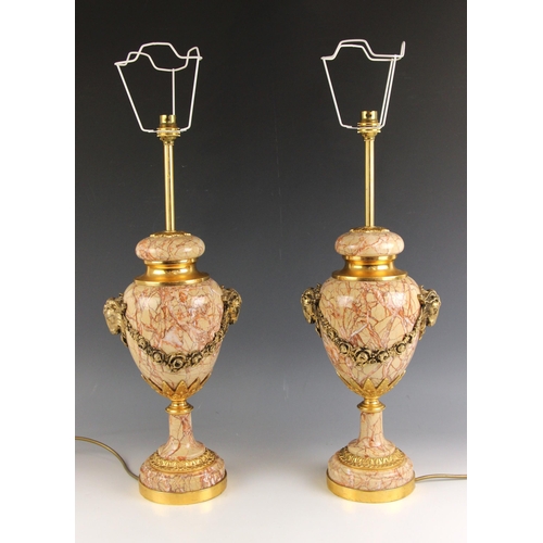 604 - A pair of coral coloured variegated marble and ormolu mounted table lamps, early 20th century, each ... 